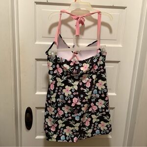 Black retro bathing suit with pastel Hawaiian style flower